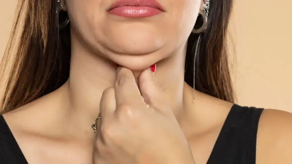 An image of a woman with double chin, sad, worried : Non Surgical Double Chin Removal Treatment in Oakham, UK